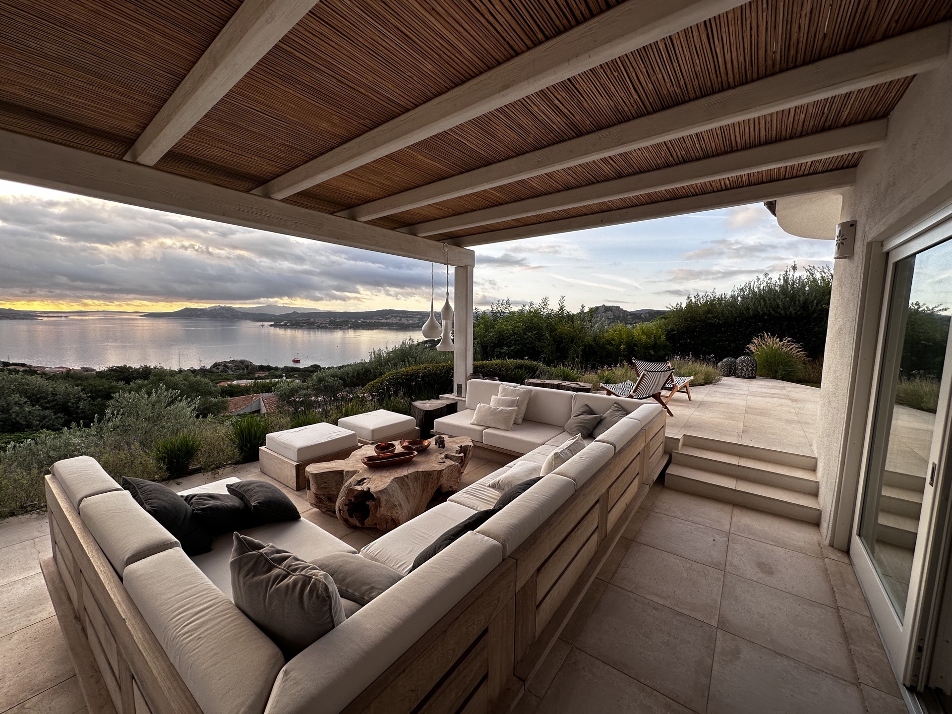 Luxury villa terrace overlooking the Mediterranean at sunset